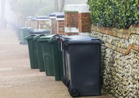 Simple and cheap hack to keep bins from blowing away as first storm of season is forecast
